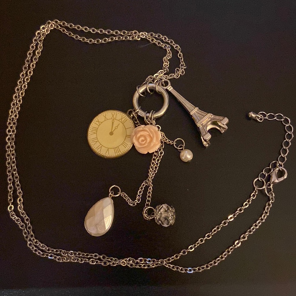 Silver feminine necklace with charms